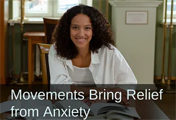 Smiling woman with a book. Text: Movements Bring Relief from Anxiety